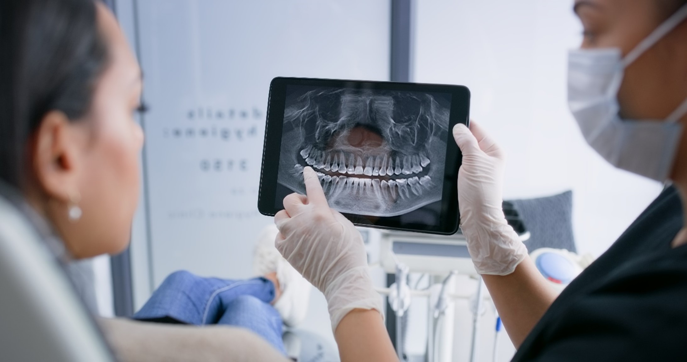 Dental provider consulting with a patient during a dental appointment