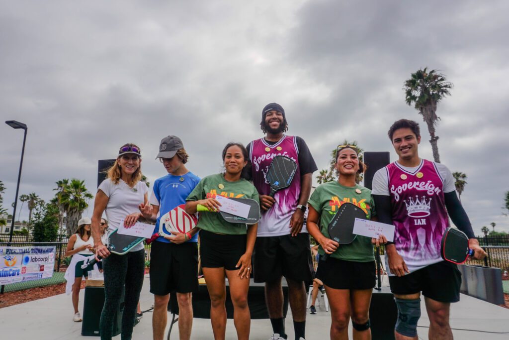 Group of people in California proudly holding their Pickleball 2025 prize