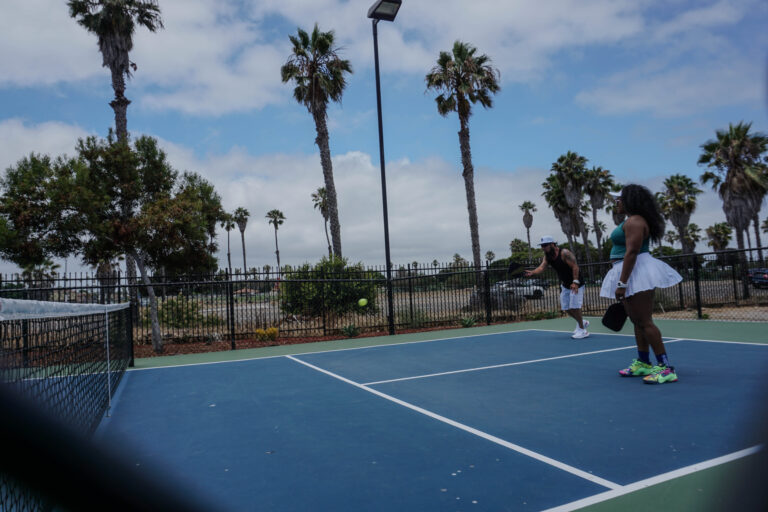 Players returning a shot at the OpSam Health event 2025 pickleball in San Diego, CA