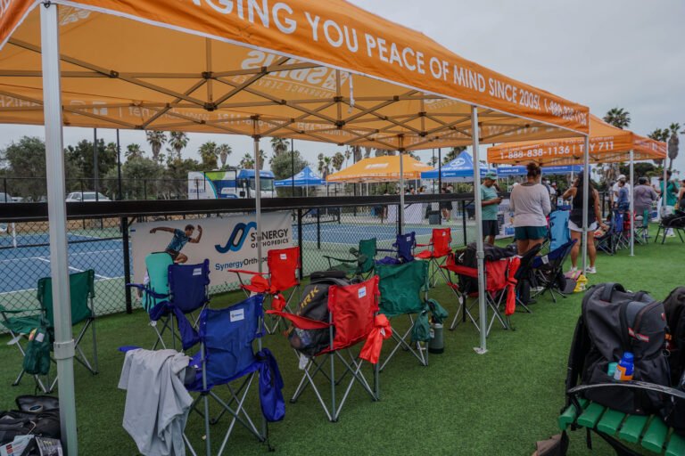 Shaded tents and folding chairs at the OpSam Health event 2025 pickleball in San Diego, CA
