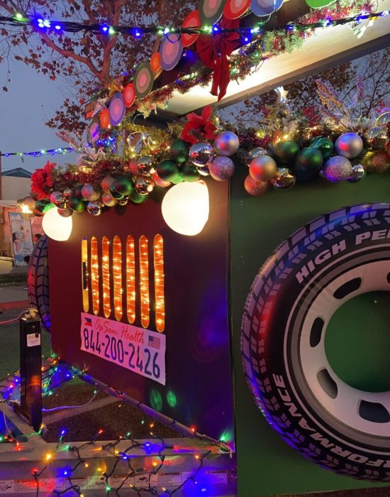 Close-up view of a parade float decorated with colorful lights in San Diego, CA