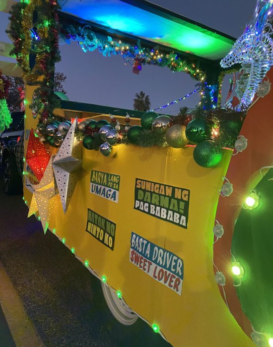 Decorated parade float with colorful lights at the Chula Vista Starlight Parade in San Diego, CA