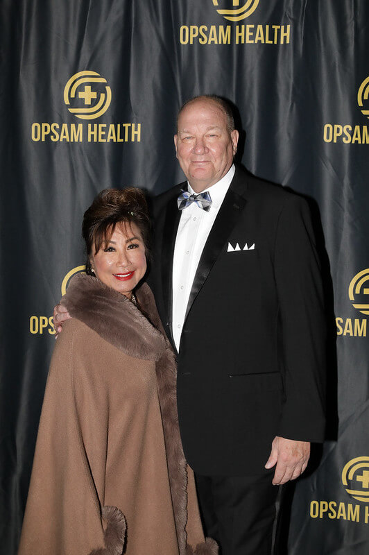 A man and woman dressed in formal wear stand together for a picture in Gala 2024 in San Diego, CA