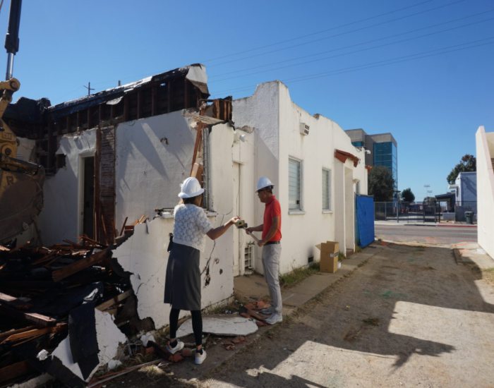 Two people are participating in a groundbreaking ceremony in San Diego, CA