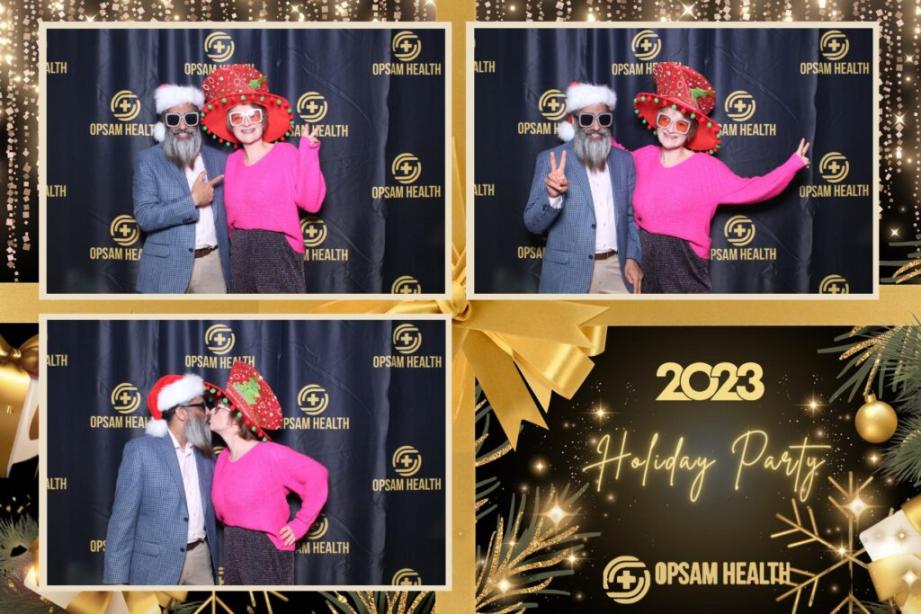 Two individuals are taking pictures at an OpSam Health employee holiday event in San Diego, CA