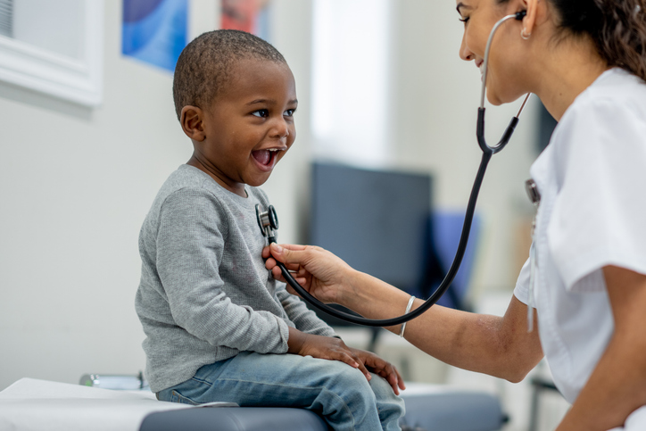 Child receiving primary care checkup at a community health clinic in National City, CA